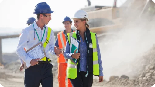 Photo of Site Managers / Supervisors on worksite wearing high-vis and PPE