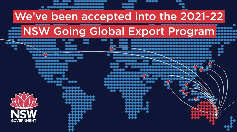 A dotted world map in blue on a dark navy background with Australia picked out in red, white flight paths arcing from Sydney to markers across Asia, Europe and North America, under the words We have been accepted into the 2021-22 NSW Going Global Export Program beside the NSW Government waratah logo