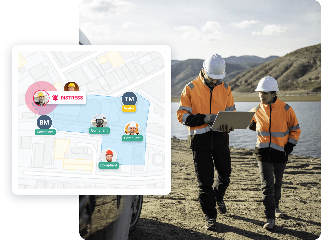 Two workers in hard hats using digital permit interface on laptop in outdoor setting